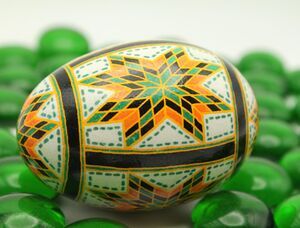 Quilt Style Batik Easter Egg with Green, Gold and Black Stars